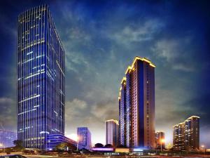 a city skyline with tall skyscrapers at night at Lavande Hotel Changsha Avenue Metro Station in Changsha