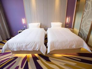 Postel nebo postele na pokoji v ubytování Lavande Hotel (Datong dongxin Plaza Branch)