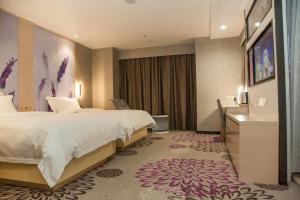 Posteľ alebo postele v izbe v ubytovaní Lavande Hotels Xianning Tonghui Square Branch