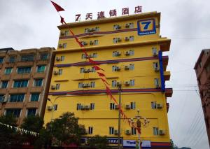 a yellow building with a sign on top of it at 7Days Inn Bijie Zhijin Chengguan in Zhijin