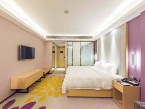 Voodi või voodid majutusasutuse Lavande Hotel Wuxi Taihu Avenue toas