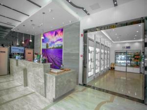 a store lobby with a counter in the middle at Lavande Hotel Nanchang Bayi Square Branch in Nanchang