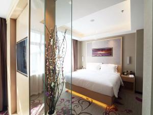 Lavande Hotel Jilin Songjiang Road Jiangwan Bridge Branch tesisinde bir odada yatak veya yataklar