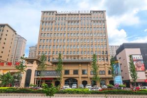 a large building with a sign on top of it at Lavande Hotel (Shijiazhuang Luquan Baoduzhai Beiguo Shopping Center Branch) in Shijiazhuang
