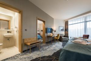 Postel nebo postele na pokoji v ubytování Hotel Zalewski
