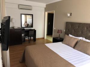 Postel nebo postele na pokoji v ubytování Hotel Paiva