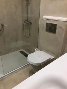 Koupelna v ubytování Hotel Paiva