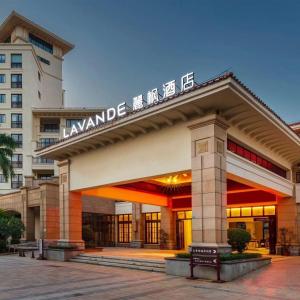 a building with a sign on top of it at Lavande Hotel Haikou Binhai Avenue in Haikou
