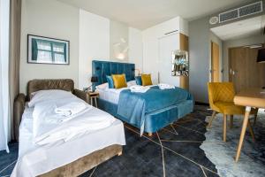 Postel nebo postele na pokoji v ubytování Hotel Zalewski