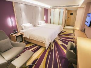 Gulta vai gultas numurā naktsmītnē Lavande Hotel Zhoushan Putuo
