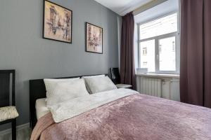 
Кровать или кровати в номере Apartment on Nevsky 82

