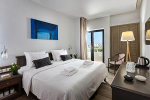 Säng eller sängar i ett rum på Castello City Hotel