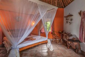 Postel nebo postele na pokoji v ubytování Karamba Eco Boutique Hotel + 37 fotografií