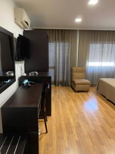TV a/nebo společenská místnost v ubytování Hotel Paiva