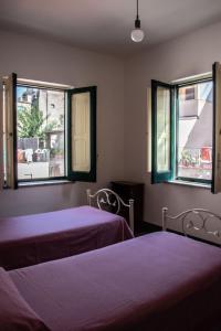 Ένα ή περισσότερα κρεβάτια σε δωμάτιο στο La Titina Casa Vacanza