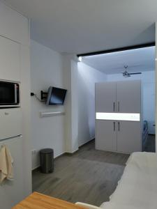 Televízia a/alebo spoločenská miestnosť v ubytovaní Apartamento Moderno y acogedor Antú, cerca de la playa
