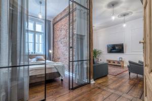 Posteľ alebo postele v izbe v ubytovaní Apartament BOHEMA