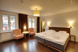Postel nebo postele na pokoji v ubytování Grännagården Hotell och Restaurang