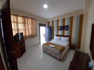 Ein Bett oder Betten in einem Zimmer der Unterkunft Hotel El Andino