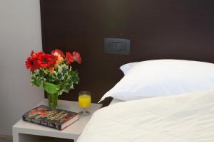 Posteľ alebo postele v izbe v ubytovaní AUTO PARK Hotel