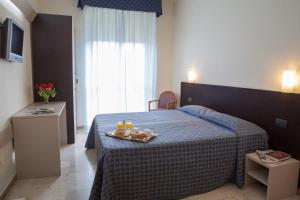 Posteľ alebo postele v izbe v ubytovaní AUTO PARK Hotel