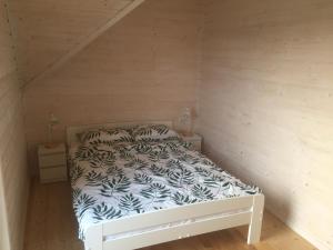 Un pat sau paturi într-o cameră la Westbeach House