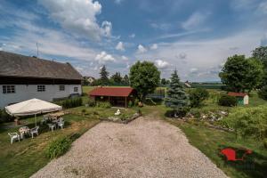 an overhead view of a yard with a house and a tent at Penzion U Kašpárků in Žehrov