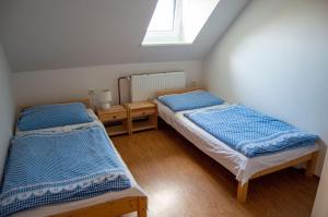 Postel nebo postele na pokoji v ubytování Penzion Holacký