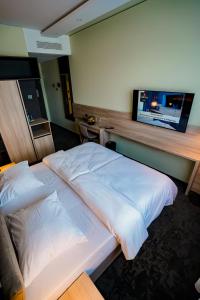 Postel nebo postele na pokoji v ubytování Hotel Viktorosa
