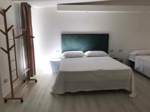 Posteľ alebo postele v izbe v ubytovaní Guest house Regina Margherita