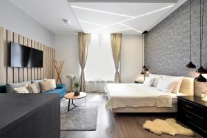 Posteľ alebo postele v izbe v ubytovaní Time Apartments Downtown