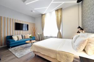 Posteľ alebo postele v izbe v ubytovaní Time Apartments Downtown