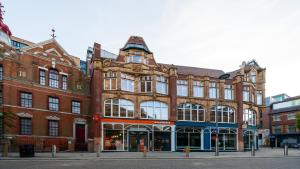 a large brick building on a city street at easyHotel Birmingham in Birmingham
