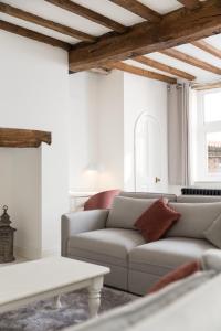 a living room with a couch and a table at York City Unique Apartment - Coffee Yard in York