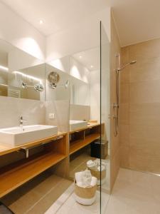 a bathroom with a sink and a shower at La Villetta 17 in Lana +33 photos