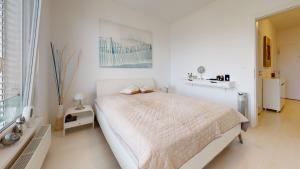 Ένα ή περισσότερα κρεβάτια σε δωμάτιο στο BIBI Centroom Apartment