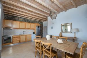 A kitchen or kitchenette at Natural Stone Villas