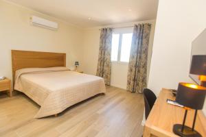 Postel nebo postele na pokoji v ubytování Hotel Cesario