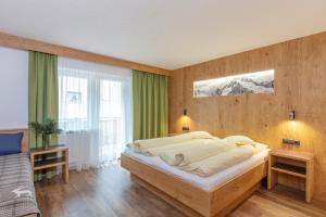 Postel nebo postele na pokoji v ubytování Haus Manfred
