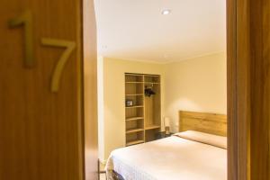Postel nebo postele na pokoji v ubytování Hotel Cesario
