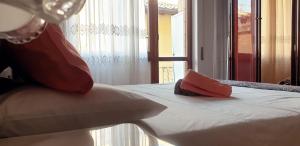 Ένα ή περισσότερα κρεβάτια σε δωμάτιο στο Casa Vacanze Carla