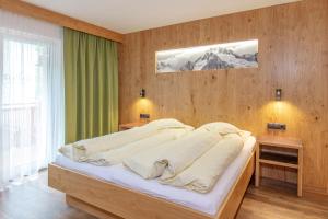 Кровать или кровати в номере Haus Manfred