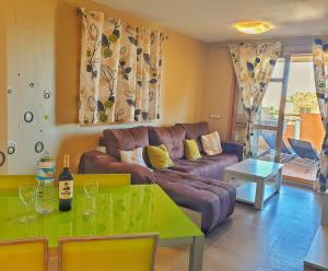 a living room with a couch and a table at Casa Cerezos in Cala de Finestrat