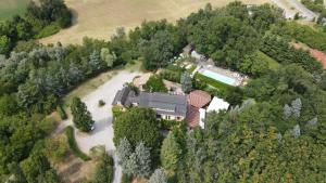 an aerial view of a house in the forest at Le Querce Hotel in Salsomaggiore Terme