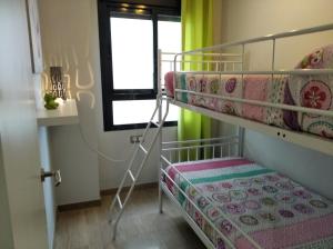 A bed or beds in a room at Camalavi