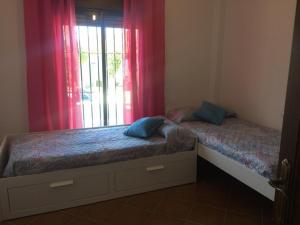Ein Bett oder Betten in einem Zimmer der Unterkunft Casa Ananda y Casa Rengue