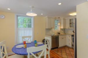 a kitchen with a table with a blue table cloth on it at Key West Villas in Key West
