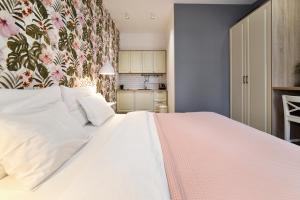 Posteľ alebo postele v izbe v ubytovaní Time Apartments Downtown