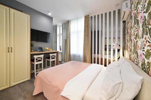 Posteľ alebo postele v izbe v ubytovaní Time Apartments Downtown