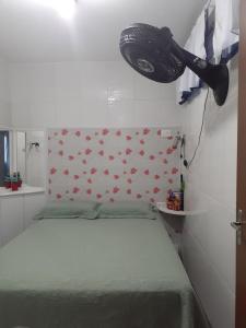 a bedroom with a bed with a head board with flowers at Apartamento Centro de Convenções in Recife